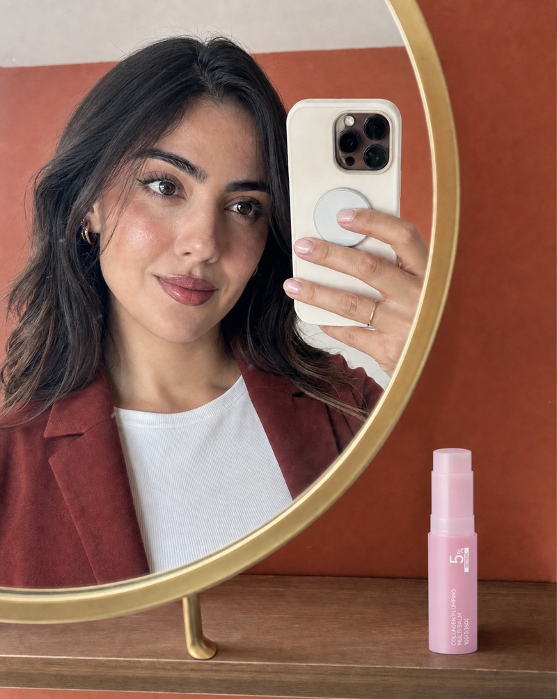 Woman holding the PDRN collagen balm stick